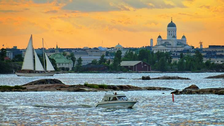 Sunset over Helsinki cathedral and the harbour.
