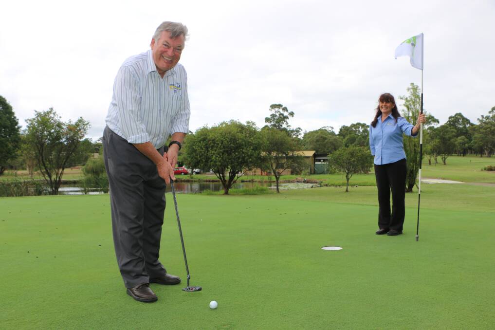 CHALLENGE: Ian Taylor hones his short game with the club's Robyn Shaw. Picture: David Stewart