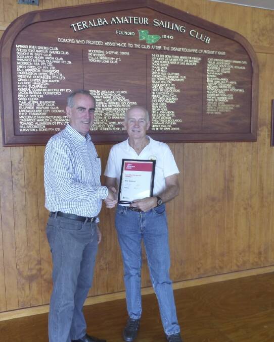RECOGNISED: Greg Piper presents Alan Caldwell with his achievement award.