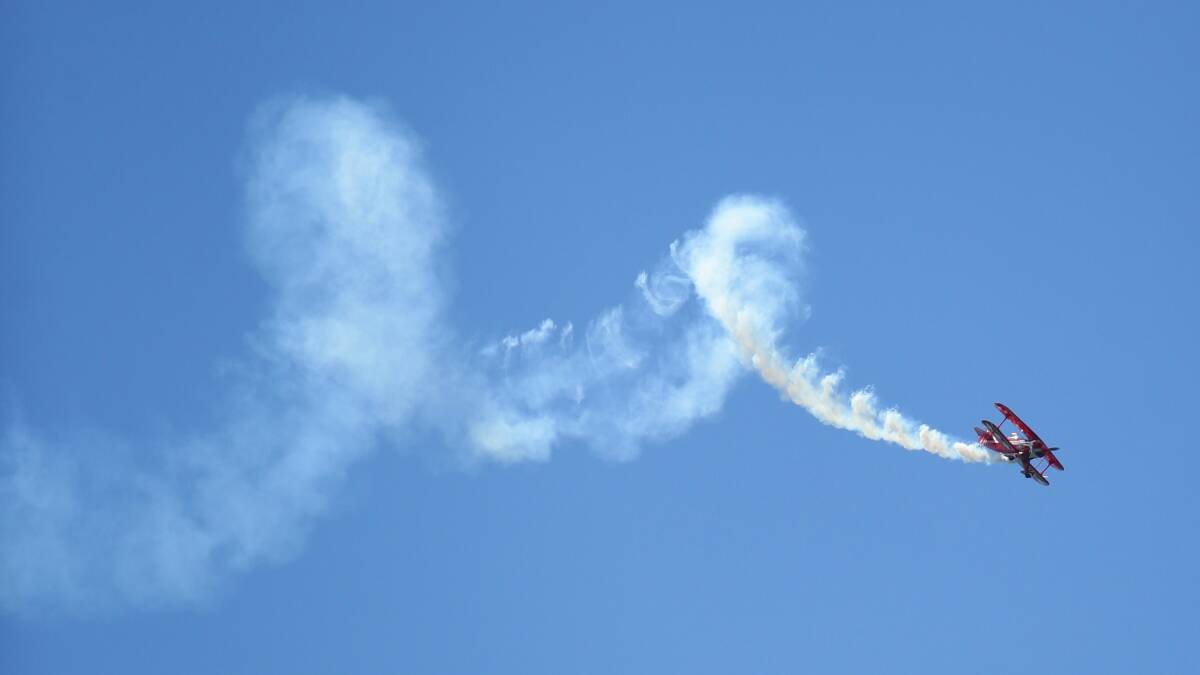 UP AND OVER: The aerobatics display at last year’s air show. Picture: Peter Stoop