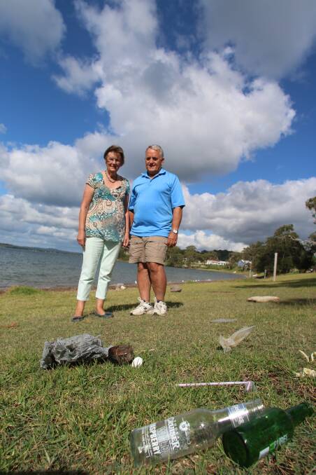 WORK TO DO: Terry and Dianne Butler, at Dobell park, Wangi Wangi, this week. Picture: David Stewart
