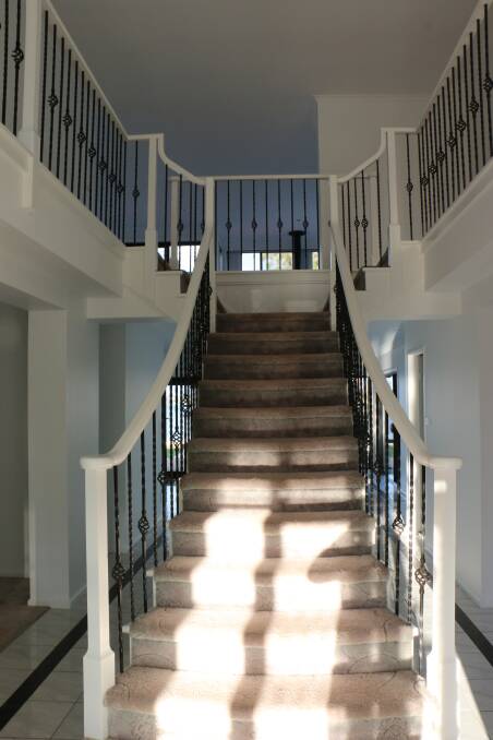 GRAND: The sun shines on the ornate stairway.