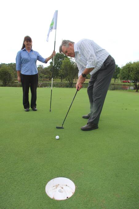 BIGGER TARGET: Morisset Country Club chief executive Ian Taylor putts to a new 20cm wide hole.  Picture: David Stewart