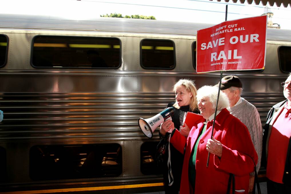 PROTEST: The Save Our Rail group makes its voice heard on the platform of Newcastle Station. Picture: Ryan Osland