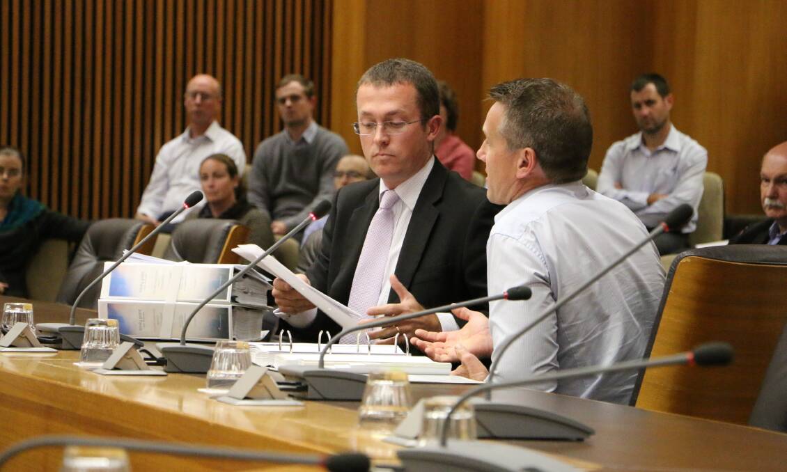 THEIR SAY: Johnson Property Group development director, Bryan Garland, left, and marina consultant Les Binkin speak at the Joint Regional Planning Panel meeting at Lake Macquarie City Council chambers on June 18. Picture: Jamieson Murphy