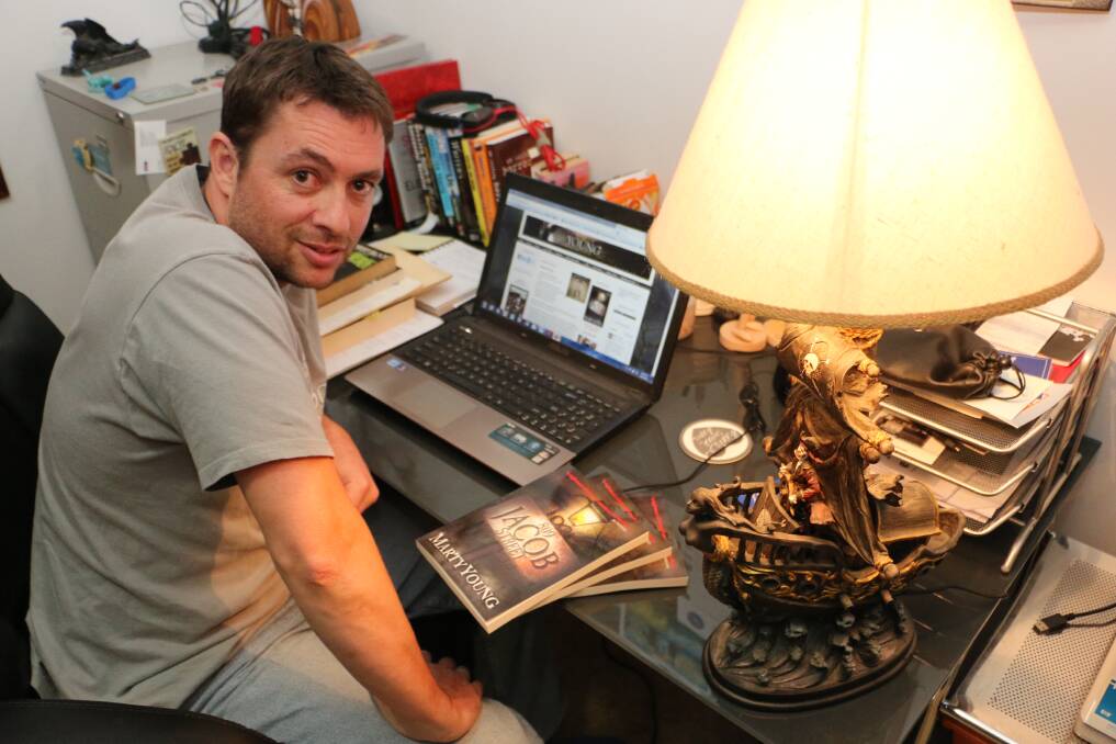WORK SPACE: Author Marty Young at the writing desk in his Brightwaters home. Picture: David Stewart