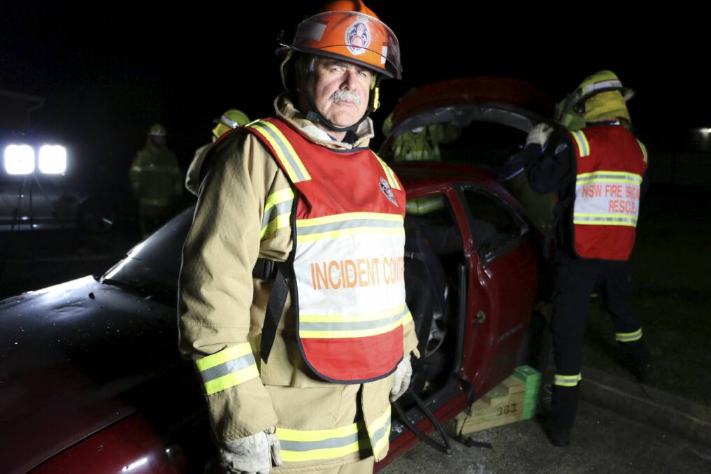 ON SHOW: Captain Steve McNulty, of the Fire and Rescue NSW station at Morisset, during a Monday night training session with his crew. The fire station will open its doors to the public on Saturday for open day. Picture: David Stewart
