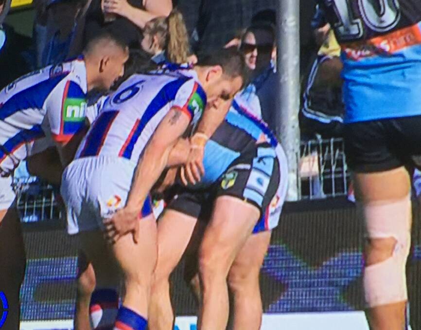 NOT AGAIN: Jarrod Mullen clutching his hamstring against the Sharks on Sunday. 