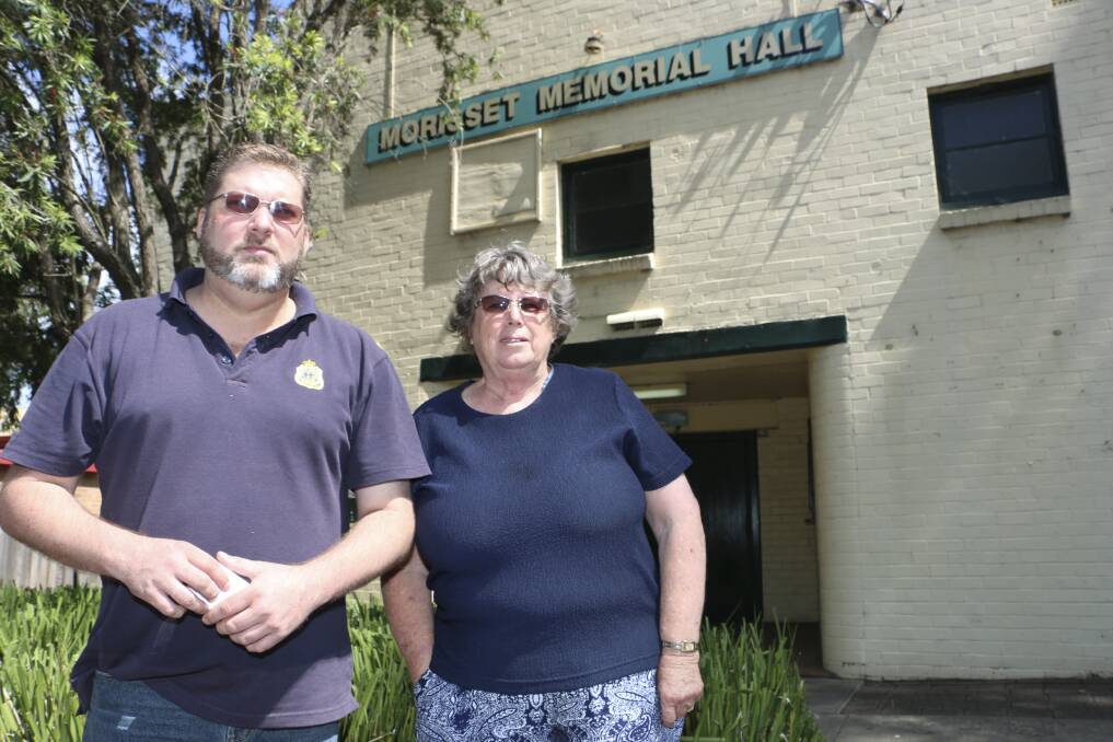 WELL USED: Val Badham, the writer, with President of the South Lake Macquarie RSL sub-Branch, Daniel Sloan, outside the Morisset Memorial Hall. Picture: David Stewart.