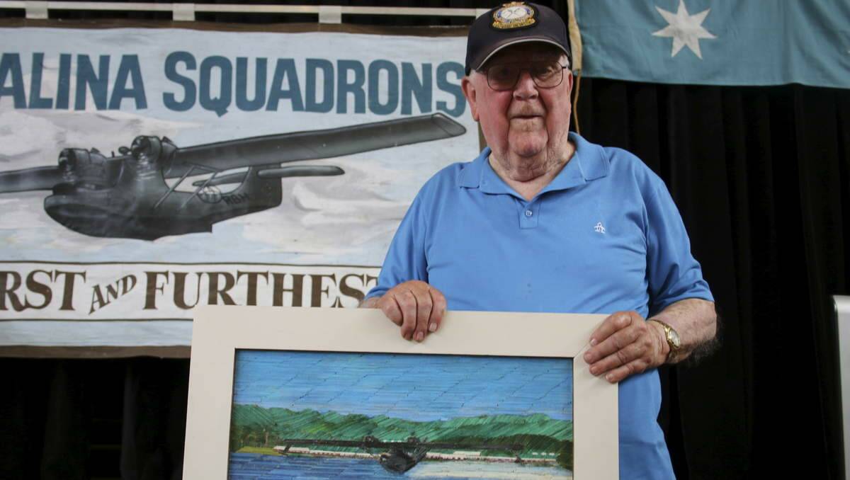 FOND MEMORIES: Norm Cromack, 92, did a Catalina engineering course at the Rathmines base in World War II. Picture here with a match stick art piece he made for the event. Picture by Jamieson Murphy