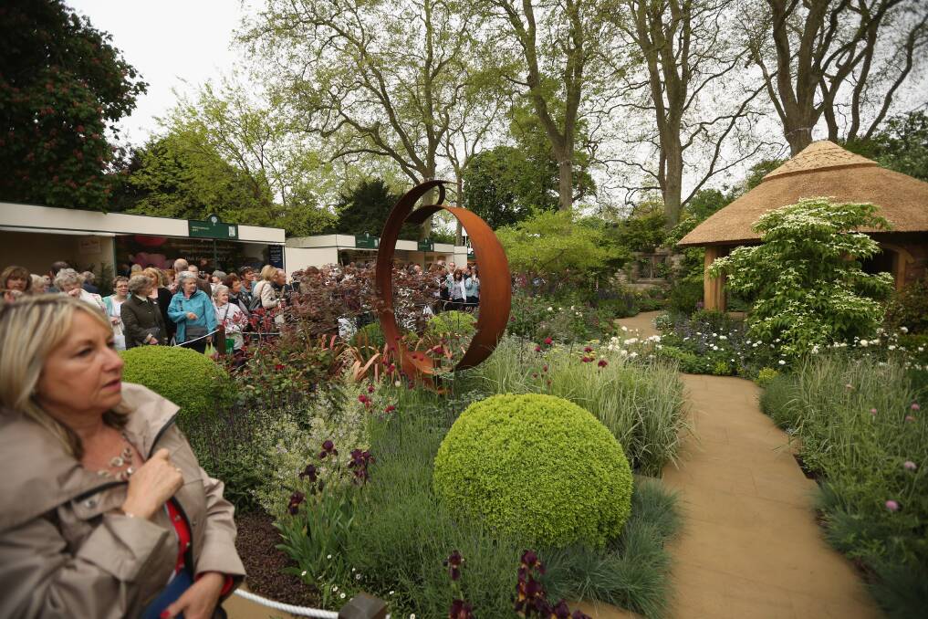 Visitors admire The M&G Centenary Garden at the RHS Chelsea Flower Show on May 21, 2013 in London, England. Photo by Oli Scarff/Getty Images