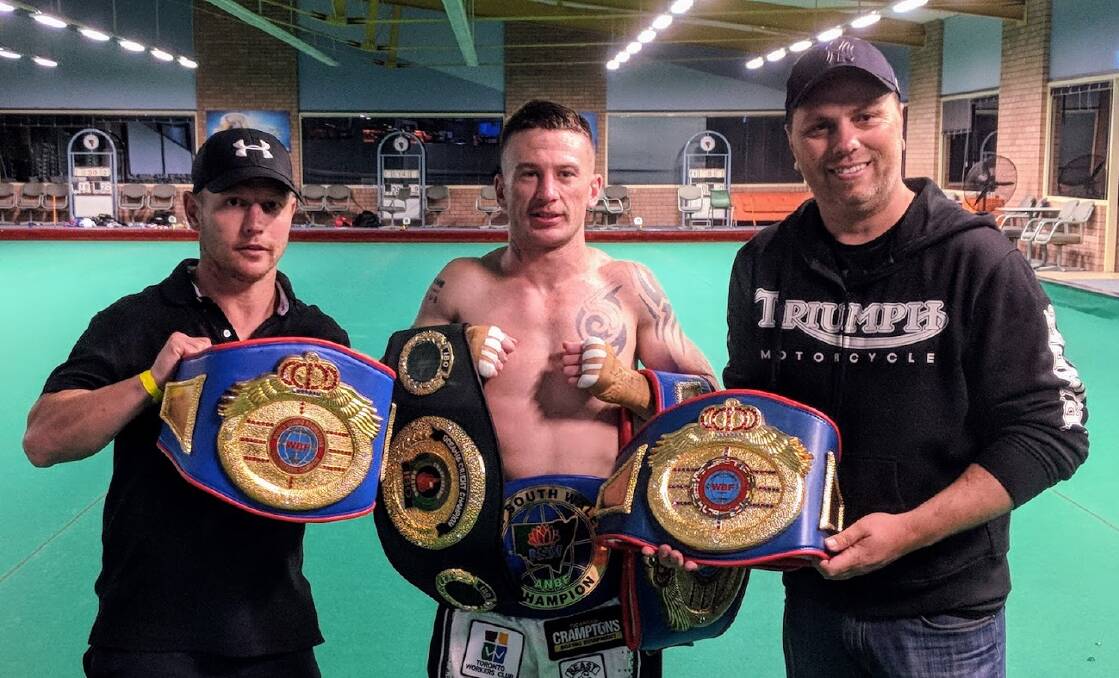 CHAMPION: Blake Minto with corner man Daniel Ford, left, and trainer Ben Crampton after collecting his fifth professional title. Picture: Supplied