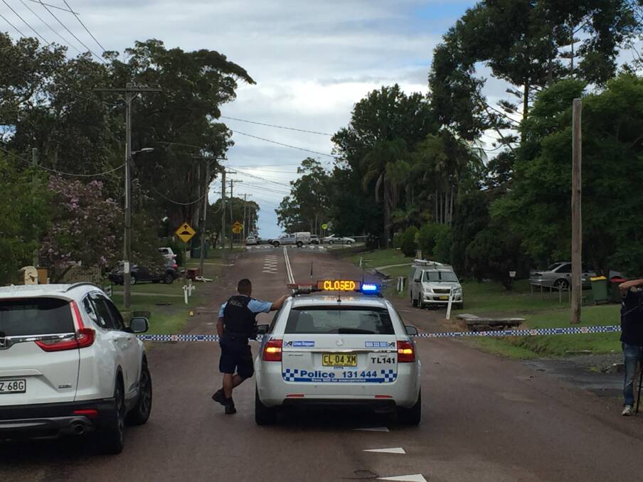 Tuggerah Lakes Police District officers set up a road block as part of a crime scene at San Remo on Wednesday. Picture: David Stewart