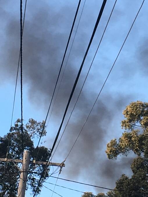 Smoke pouring into the sky soon after the explosion and fire took hold