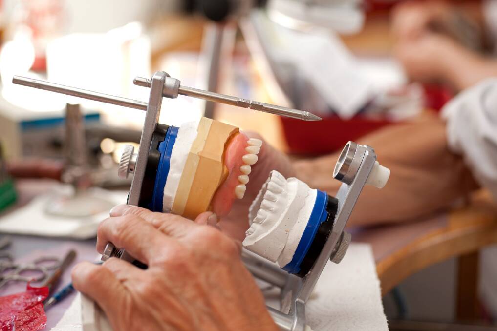 RESTORING SMILES: Dental prosthetist Mark McLaren has decades of experience and does all of his own technical work.