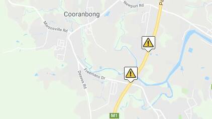 Truck rollover causes long traffic delays on M1 at Cooranbong