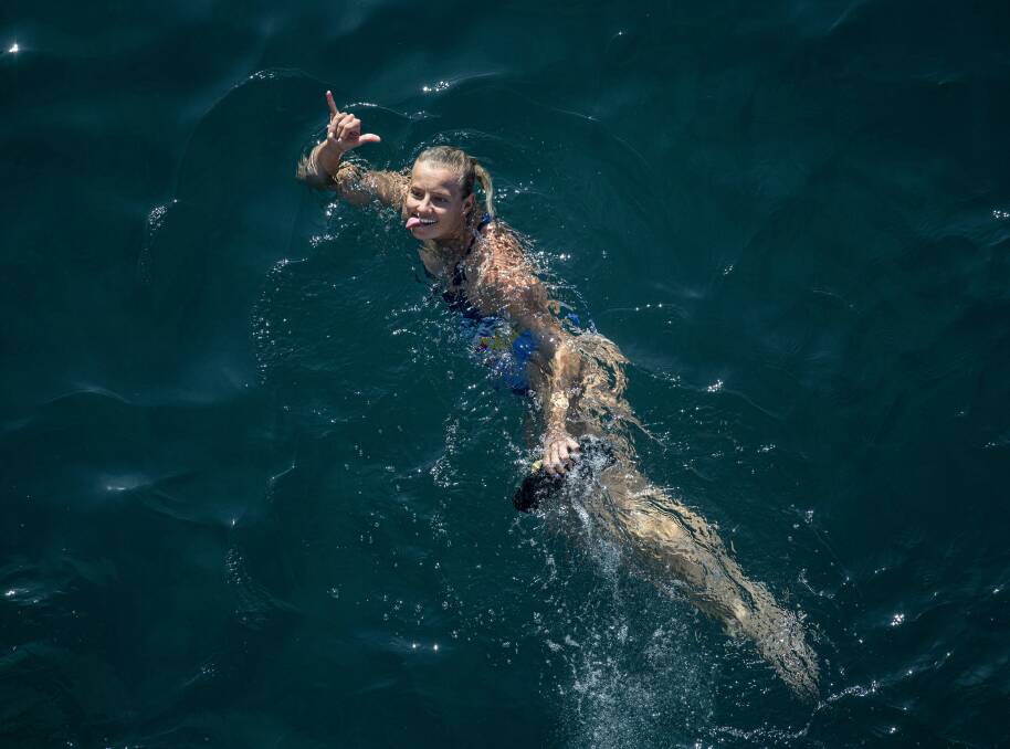 CROWD FAVOURITE: Lake Macaquarie's Rhiannan Iffland acknowledges the fans after another successful dive in Italy. Picture: Dean Treml/Red Bull Content Pool