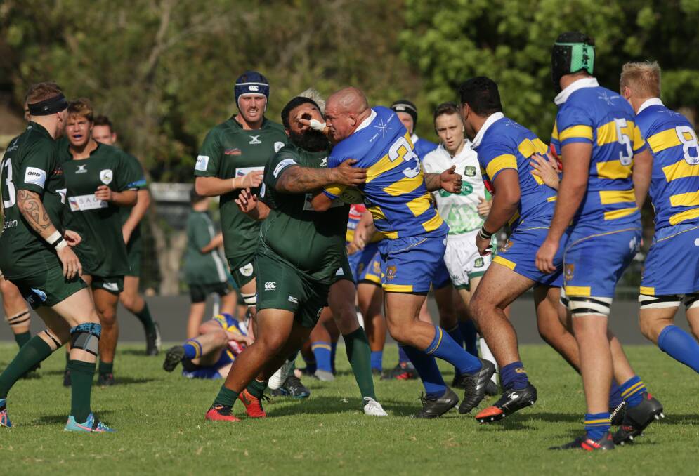 CRUNCH TIME: Hamilton prop Geraint Weaver runs into heavy traffic in Saturday's clash with Merewether Carlton at Townson Oval, which the Greens won 20-19. Picture: Simone De Peak