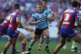 Paul Gallen charges into Newcastle's ruck during his playing days with Cronulla. Picture by Jonathan Carroll