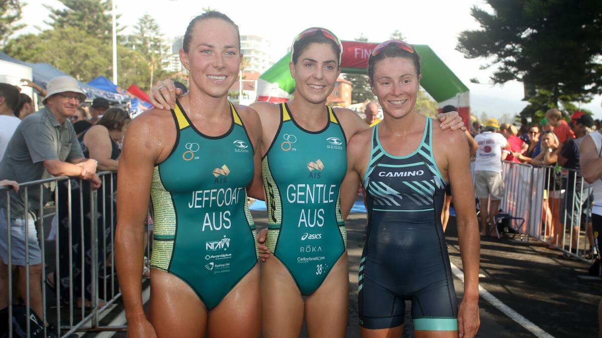 Emma Jeffcoat, Ashley Gentle and Natalie van Coevorden the Australia Day Aquathon at Wollongong Harbour. They're all in the hunt for an Olympics berth. Photo: Georgia Matts
