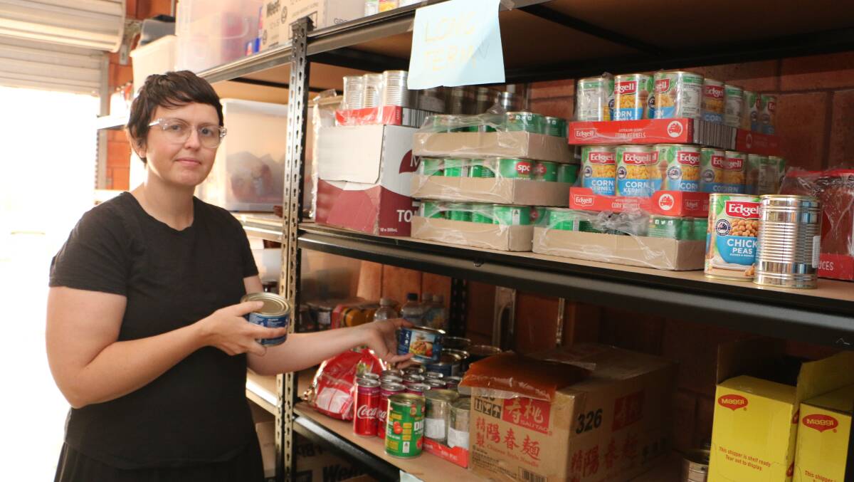 MEETING PLACE: Brooke Murphy with some of the pantry items available at The Hub in Morisset. Picture: David Stewart