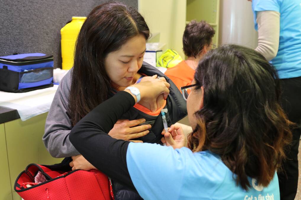 Immunity: Kanako Yajima, of Lambton, received one of the free flu vaccines at the John Hunter Hospital on Monday.