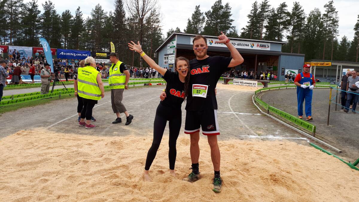 AUSSIE CHAMPS: Adam Cullen and his girlfriend Tylee Robinson after completing the course at the Wife Carrying World Championships in Finland. Picture: Supplied