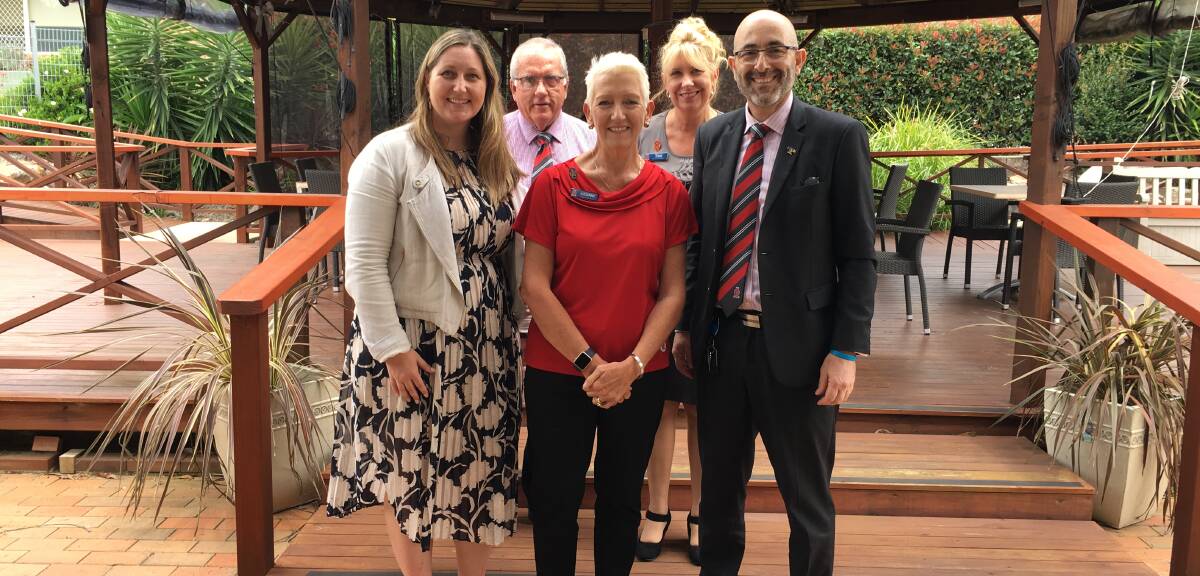 ROADSHOW: Frank Price, right, with Dobell MP Emma McBride, left, and Peter Mackinnon, Louanne Riboldi and Toni Giles of RFBI Lake Haven Masonic Village, during the CEO's visit last week. Picture: Supplied