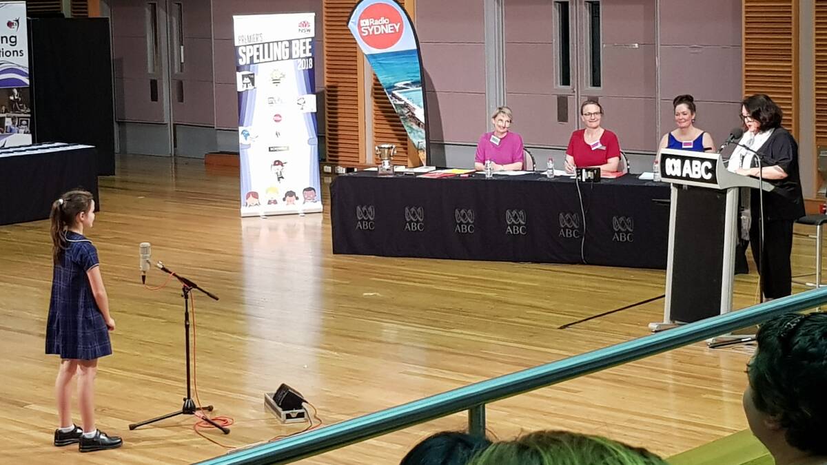 WELL PLAYED: Ella Huber, 9, of Cooranbong Public School listens to ABC Radio host Wendy Harmer pose a word for her to spell in the Premier's Spelling Bee state final in Sydney. Picture: Supplied