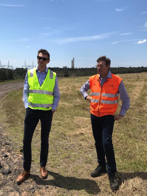 RIGHT HERE: Enernet Global president Paul Matthews, left, and Delta Electricity's Greg Everett inspect the site of the Vales Point solar project. Picture: Supplied