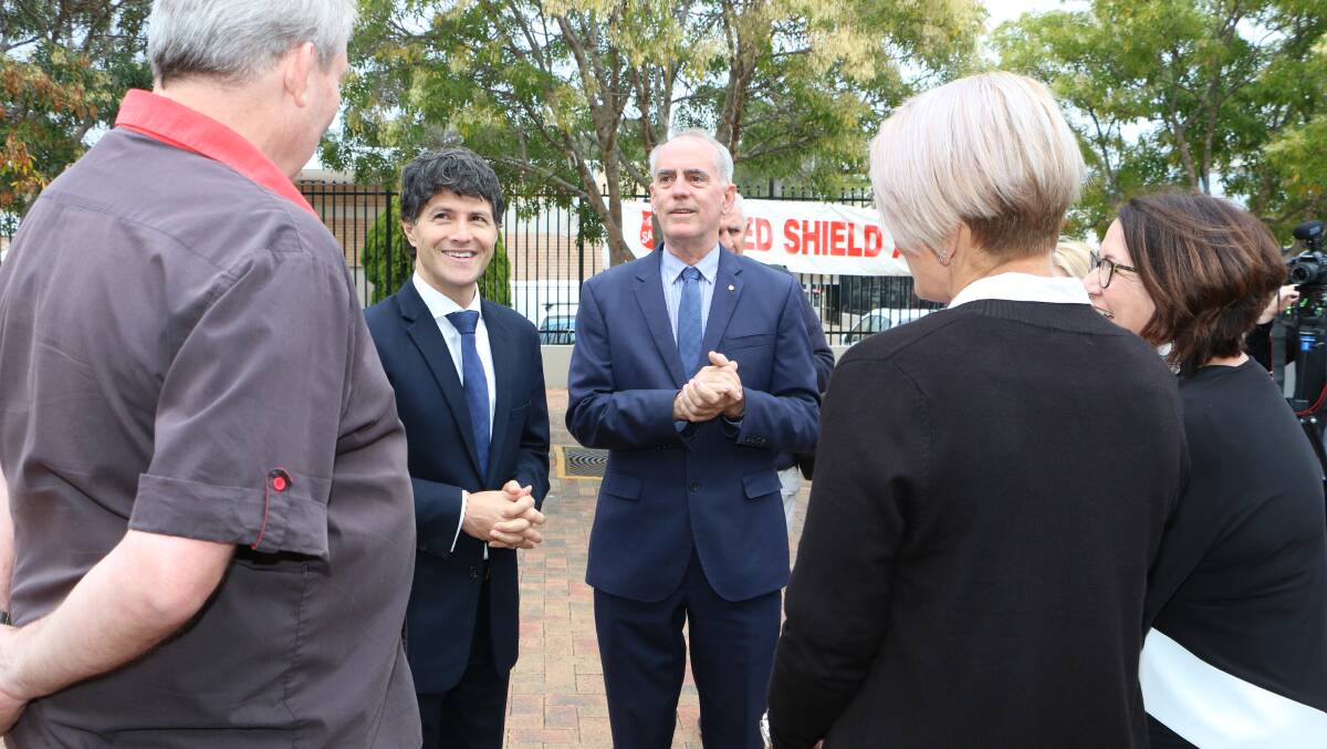 INDEPENDENT: Greg Piper, right, with NSW Minister for Finance, Services and Property, Victor Dominello, meeting locals in Toronto. Picture: David Stewart