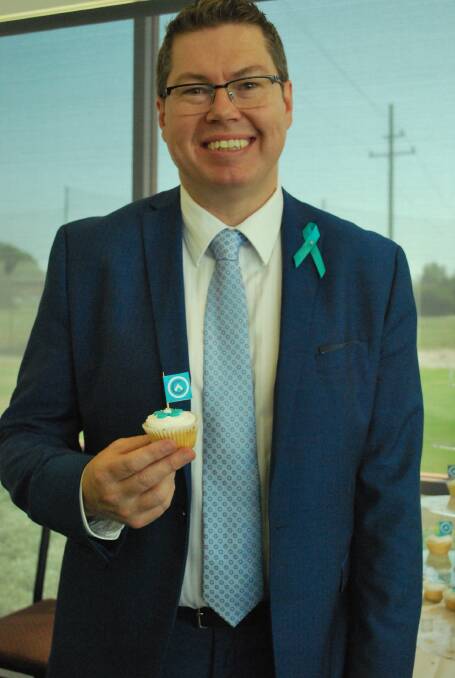 Member for Shortland, Pat Conroy, with a teal cupcake at last year's 'Morning Teal'. Teal is the colour of Ovarian Cancer Australia. Picture: Supplied