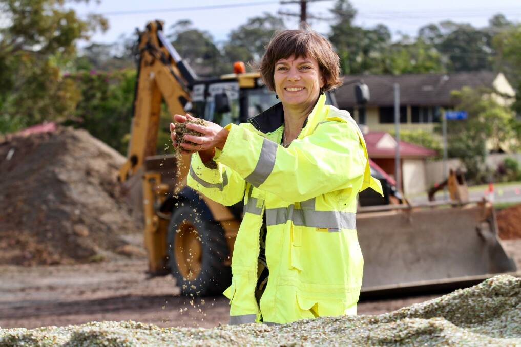 Lake Macquarie City Council's Dr Alice Howe samples the glass sand used in civil works projects across the city. Picture: Supplied