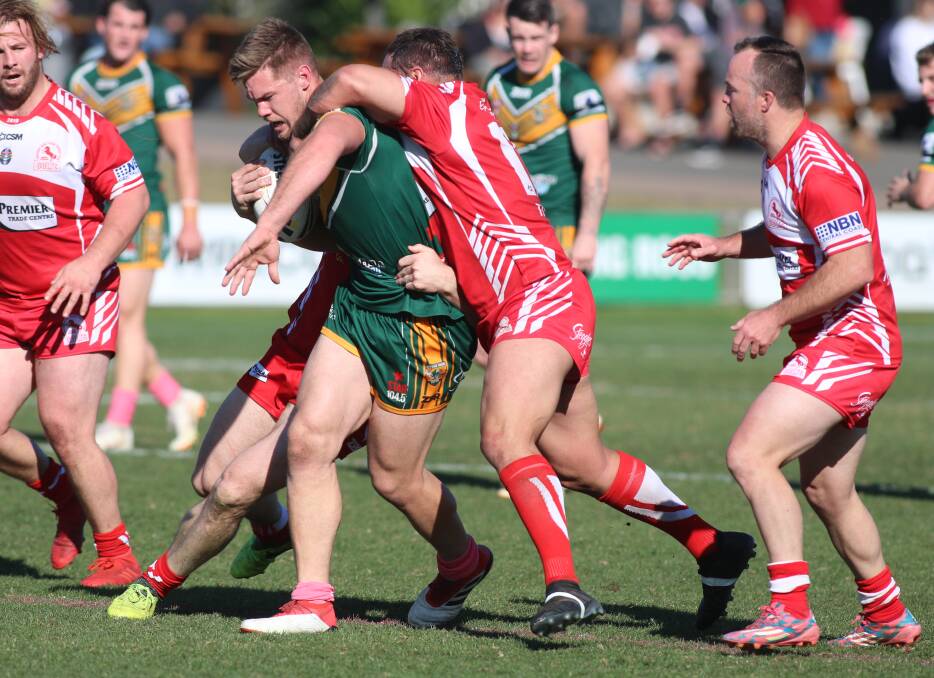 POWER GAME: Wyong prop Jake Lewis surges into the Kincumber defence at Kanwal on Sunday. He scored close to the posts in the first half. Picture: David Stewart