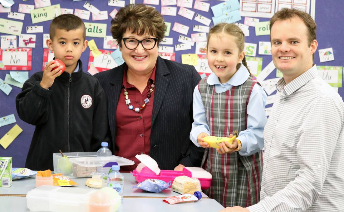 HEALTHY OPTIONS: Local kindergarten students Oliver Proctor and Ella Coughlan with nib foundation director Michelle McPherson and Associate Professor Luke Wolfenden. Picture: Supplied