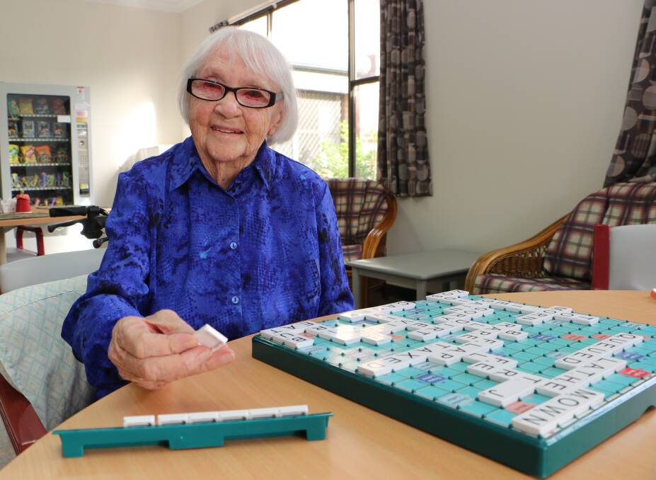 WORD PLAY: Melva Henry celebrated her 105th birthday on Friday with her favourite pastime, a game of Scrabble with friends. Picture: David Stewart