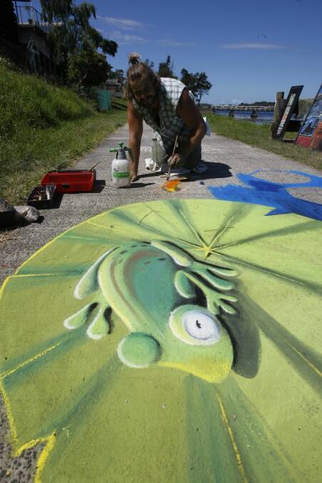 Artist Simon Thomas, of Wollongong, creating an artwork on the pavement at Southside Arts Festival, at Lake Heights. Experienced artists will display their works at Chalk the Walk, at The Entrance, from January 17 to 20. Picture: Dave Tease