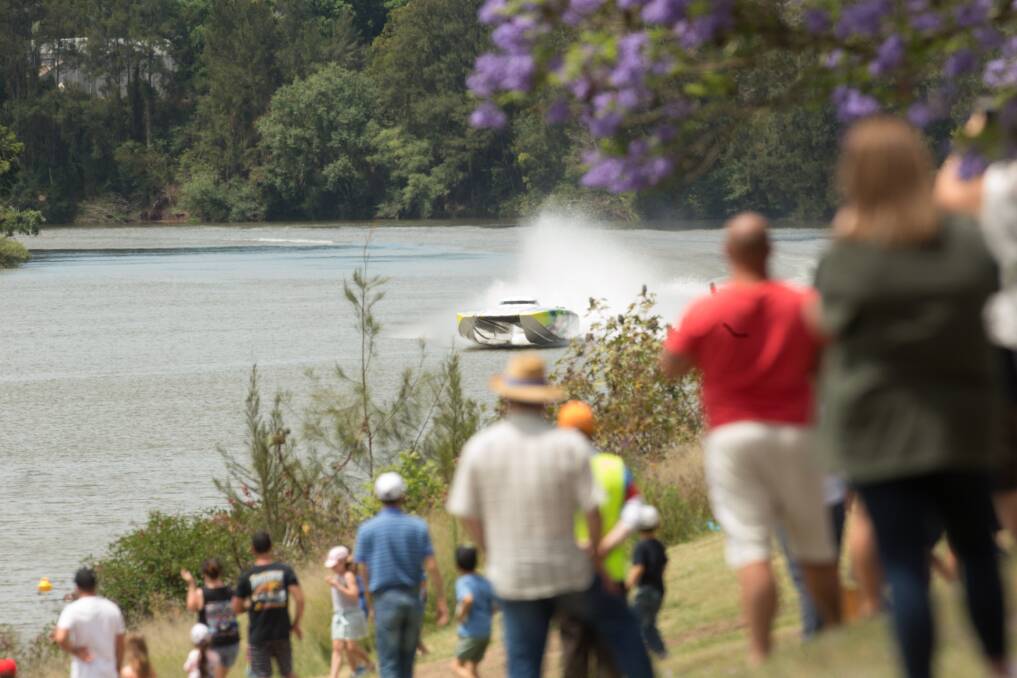 DON'T BLINK: Spectators catch a glimpse of Lake Macquarie's Darren Nicholson on the Hawkesbury River at the weekend. Picture: Geoff Jones