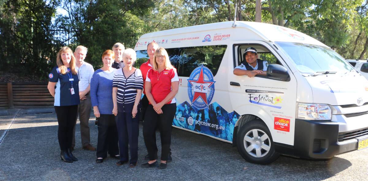 NEW WHEELS: Senior Constable Ha Son at the wheel, with Rosmairi Dawson, left, and representatives of Morisset Community Festival and Hunter Office Supplies of Morisset.