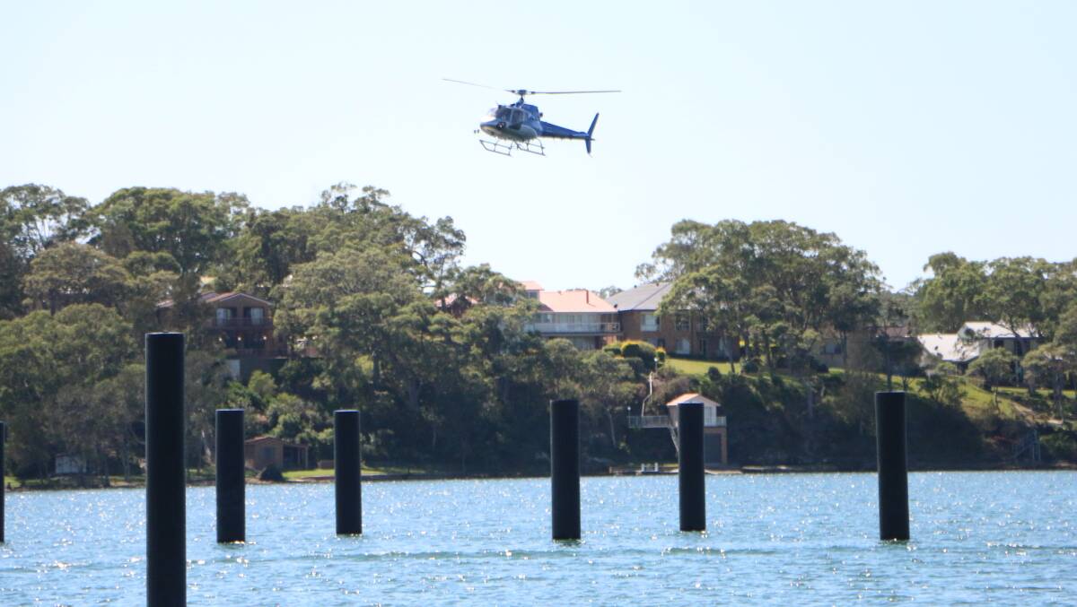 A Firebird 288 helicopter approaches the site of the proposed helipad at Trinity Point marina during acoustic testing in 2016. Picture: David Stewart
