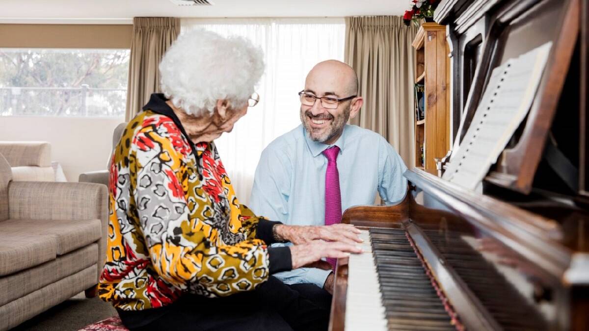 FINALIST: RFBI chief executive officer, Frank Price, meets a resident of one of the organisation's 22 aged care facilities. Picture: Supplied