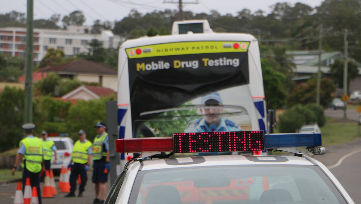 CRACKDOWN: Lake Macquarie police at the random breath and drug testing site on Awaba Road, in Toronto, on Friday. Motorists could expect to encounter more testing, "and it will be ongoing", they said. Picture: David Stewart