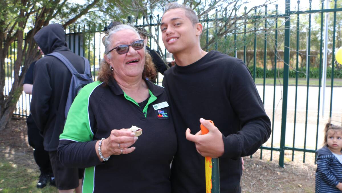 Year 10 Morisset High School student Cherokee Townsend shows his appreciation for the work of Aboriginal education officer Selena Archibald, at a ceremony last year to mark 25 years of the Aboriginal learning centre at the school. Picture: David Stewart