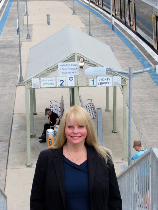 ALL ABOARD: Labor's candidate for the seat of Lake Macquarie, Jo Smith, pictured at Booragul station. Labor is promising free public transport for children.