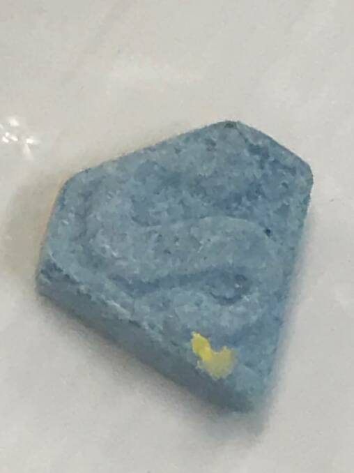 Police issued this image of one of the blue tablets they believe caused the hospitalisation of 11 people over the weekend. Picture: Supplied