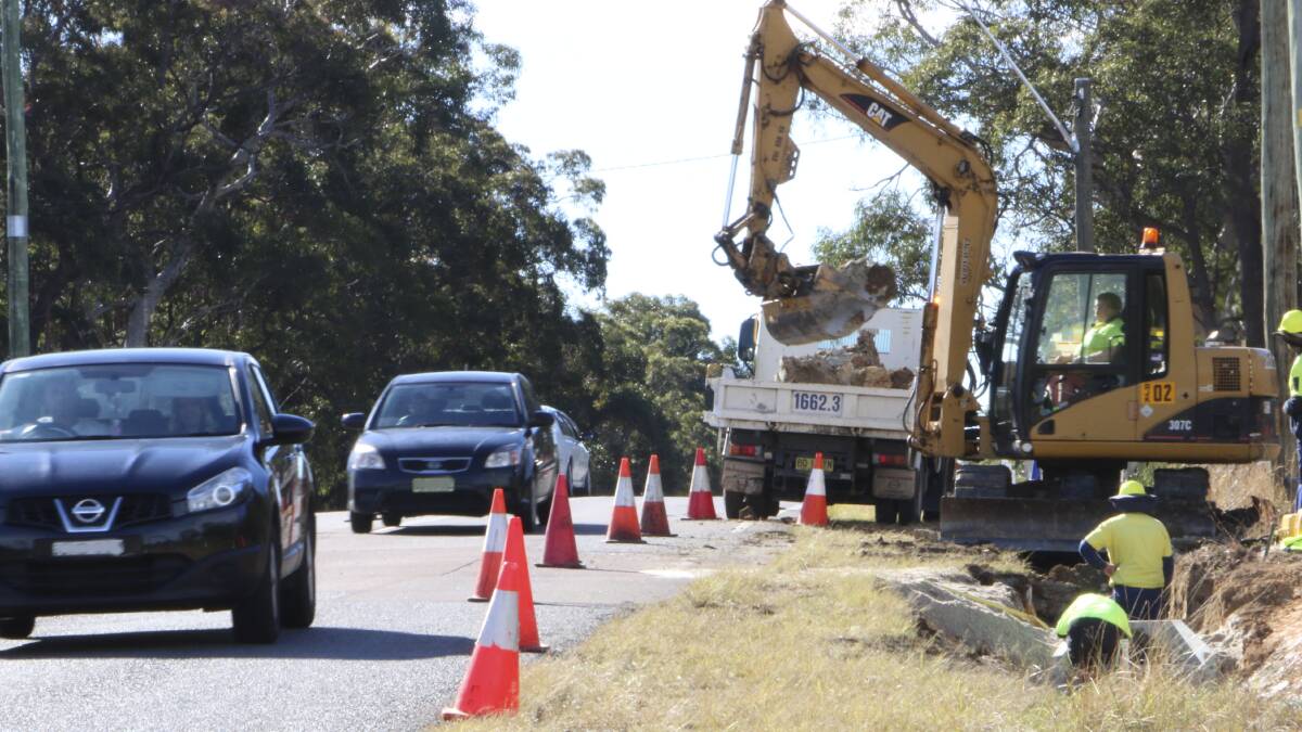 BUSY ROUTE: Council works on Wyee Road in 2014. The latest section of works, on the Morisset side of the intersection with Ruttleys Road, have started. Picture: David Stewart