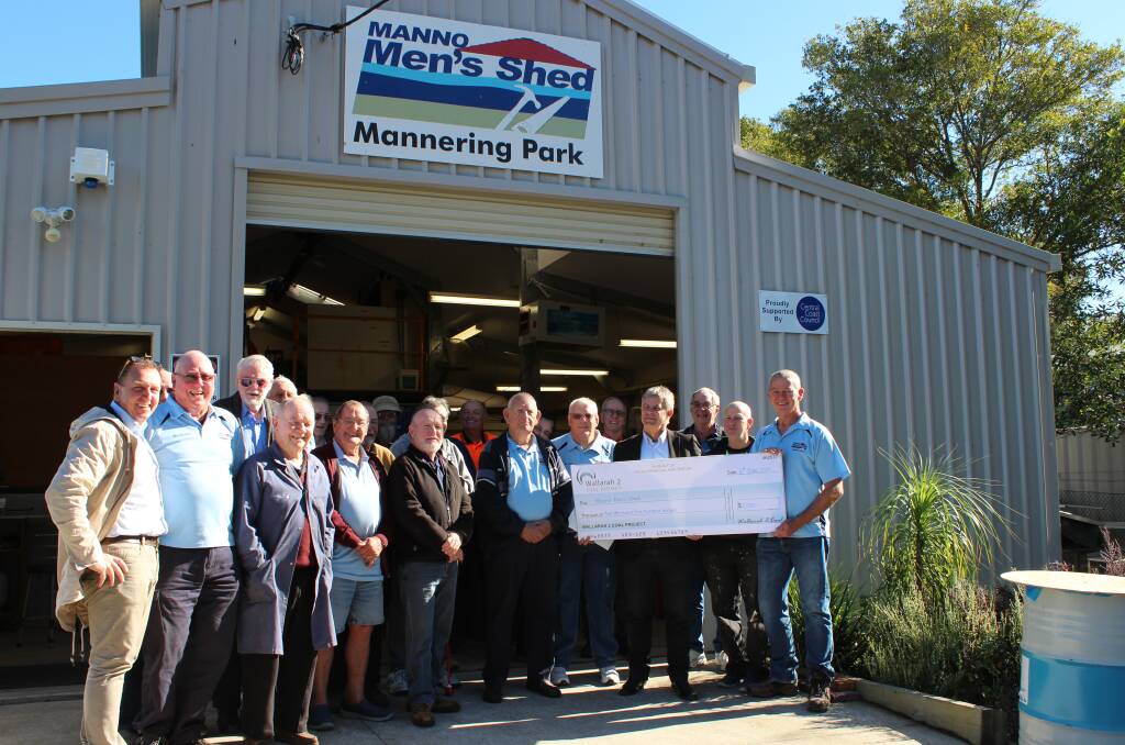 HAPPY FELLAS: Newcastle Mens Shed Association regional manager, Marty Leist, left, with members of Manno Mens Shed and Wallarah 2's Peter Smith, holding the cheque. Picture: Supplied