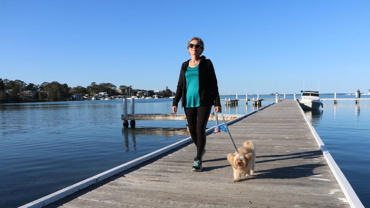 WITH PURPOSE: Liz Wright and her dog Evie in training at Wangi Wangi for the lakeside walk in October. Picture: David Stewart