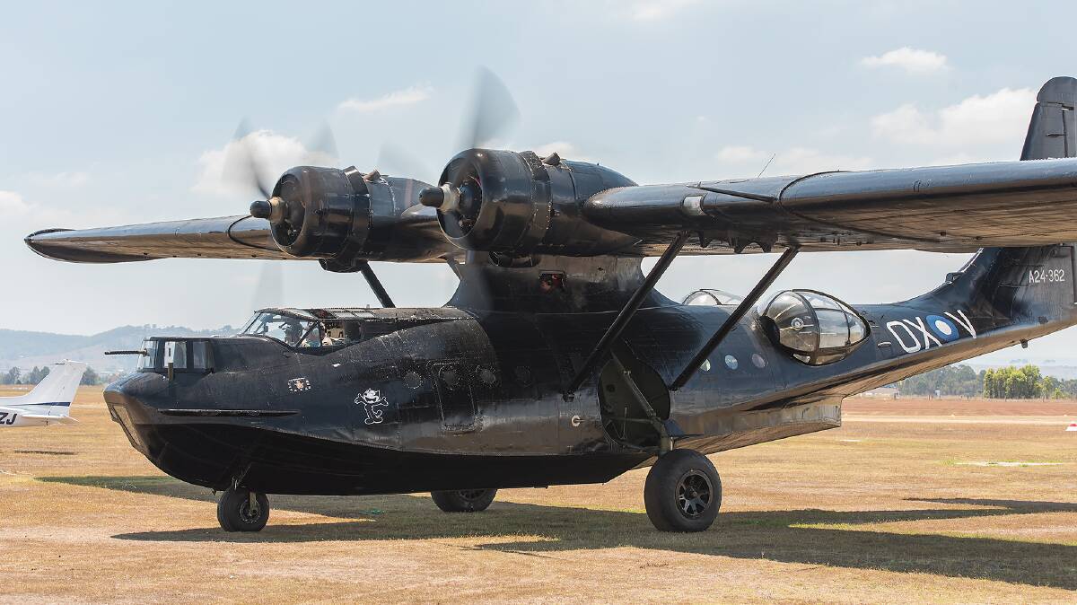 ROAR POWER: With a new engine installed, Felix the black Catalina fires up for its return journey to the NSW South Coast on Saturday. Picture: Chris VanderSchaaf