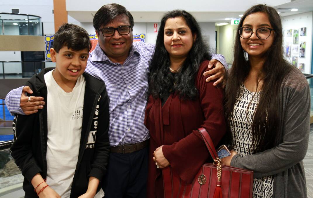 EMOTIONAL DAY: Dr Anand Gopal Dube with his family, from left, son Shiv, 11, wife Rashmi and daughter Shaila, 16. Picture: Supplied